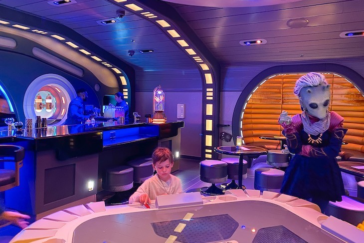 An unlikely instructor in sabaac at Sublight Lounge
