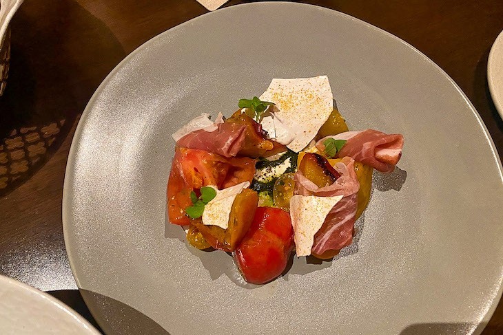 Burrata, heirloom tomato, peach, prosciutto, basil